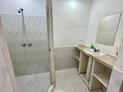 a bathroom with a shower and a sink at OUR HOME SAN ANTONIO in Cali
