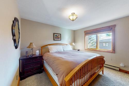 a bedroom with a large bed and a window at Galena Street Getaway in Frisco
