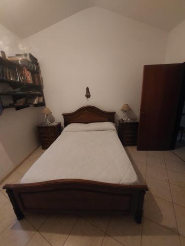 Кровать или кровати в номере Casa céntrica en Tanti