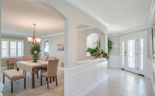 a dining room and living room with a table and chairs at Dolphin Cove in Cocoa Beach Fl in Cocoa Beach