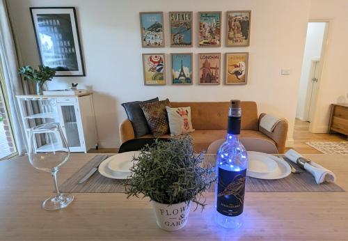 a bottle of wine sitting on top of a table at Kookaburra Place in Thornleigh