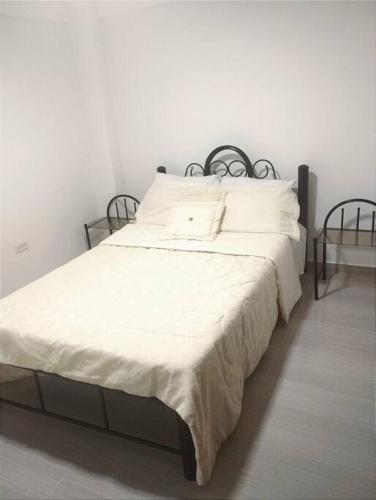 Кровать или кровати в номере Hermoso y Acogedor Apartamento en Las Gaviotas