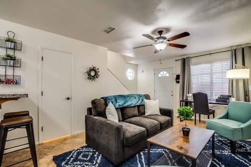 a living room with a couch and a table at 2 Community Pools-Fully Stocked for Longer Stays in Mesa