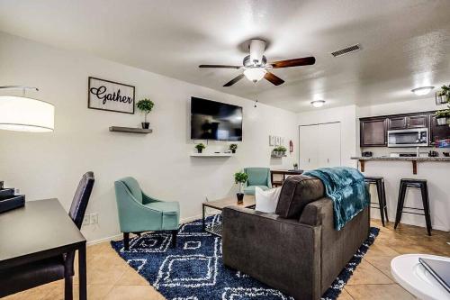 a living room with a couch and a table at 2 Community Pools-Fully Stocked for Longer Stays in Mesa