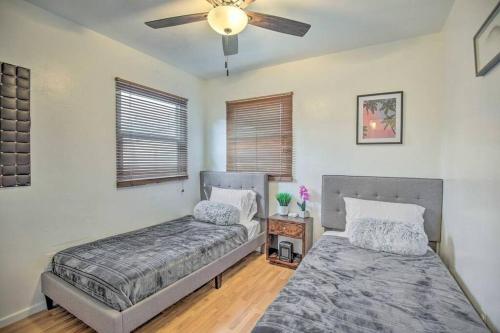 a bedroom with two beds and a ceiling fan at Gorgeous Pacific Beach and Mission Bay Home. Walking distance to the Bay and Golf Course. in San Diego