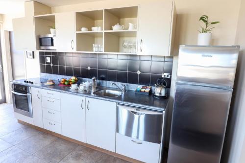 Dapur atau dapur kecil di Coleraine Suites & Apartments