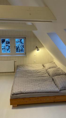 Postel nebo postele na pokoji v ubytování Izerína Cottage