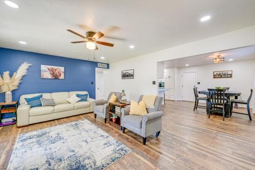 a living room with a couch and chairs and a table at Visalia Vacation Rental with Yard 1 Mi to Downtown in Visalia