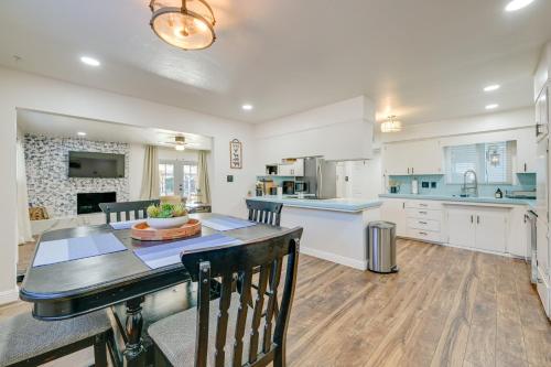 a large kitchen with a table and a dining room at Visalia Vacation Rental with Yard 1 Mi to Downtown in Visalia