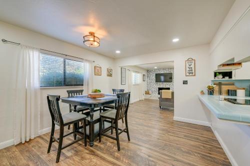 a dining room and kitchen with a table and chairs at Visalia Vacation Rental with Yard 1 Mi to Downtown in Visalia