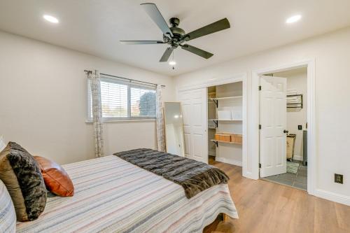 a bedroom with a bed and a ceiling fan at Visalia Vacation Rental with Yard 1 Mi to Downtown in Visalia