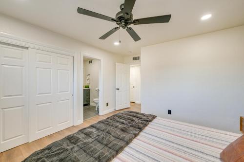 a bedroom with a bed and a ceiling fan at Visalia Vacation Rental with Yard 1 Mi to Downtown in Visalia