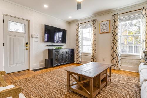 a living room with a table and a couch at Chic Indianapolis Home with Patio Less Than 2 Mi to Downtown in Indianapolis