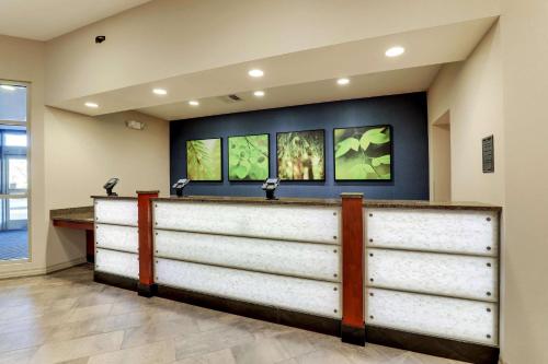 a bar in a hospital lobby with three windows at Drury Plaza Hotel Denver Westminster in Westminster