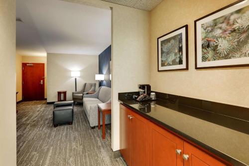 a hotel room with a living room with a hotel room gmaxwell gmaxwell gmaxwell at Drury Plaza Hotel Denver Westminster in Westminster
