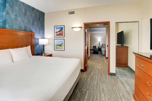 a hotel room with a bed and a television at Drury Plaza Hotel Denver Westminster in Westminster