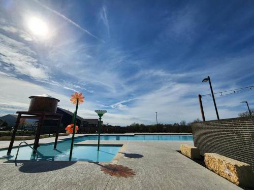 a large swimming pool with a sky background at Angelic in Elgin