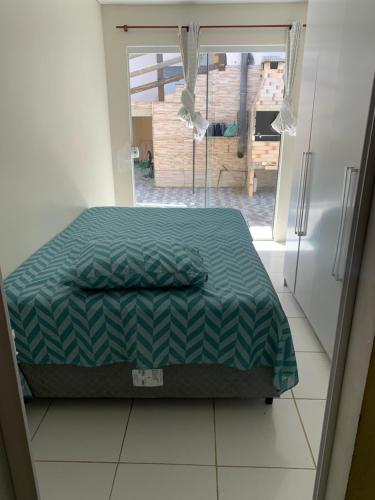 Ein Bett oder Betten in einem Zimmer der Unterkunft Férias e Trabalho