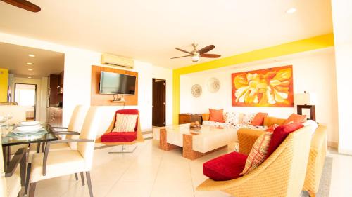 a living room with a couch and a table at Apartment Alcatraz, 4BR Oasis with Breathtaking Vi in Nuevo Vallarta 