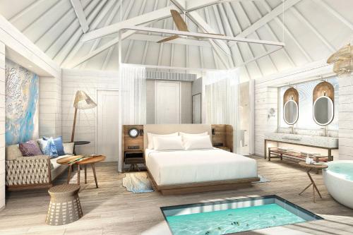 1 dormitorio con cama y bañera. en The Westin Bora Bora Resort & Spa, en Bora Bora