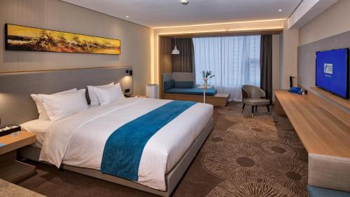 Ένα ή περισσότερα κρεβάτια σε δωμάτιο στο Holiday Inn Express Liaocheng Chiping by IHG