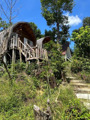 a house on a hill with stairs leading to it at Nest Jungle in Koh Rong