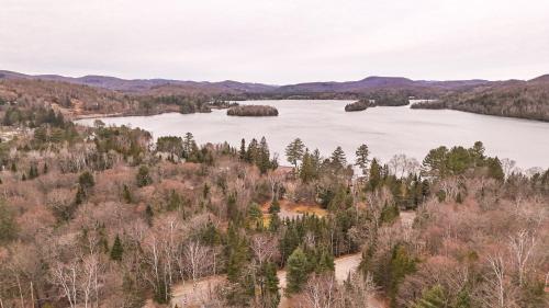 an aerial view of a lake with trees at Big Sunshine in Mont-Tremblant
