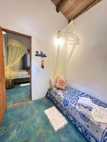 Ένα ή περισσότερα κρεβάτια σε δωμάτιο στο Casa Bio Arraial DAjuda