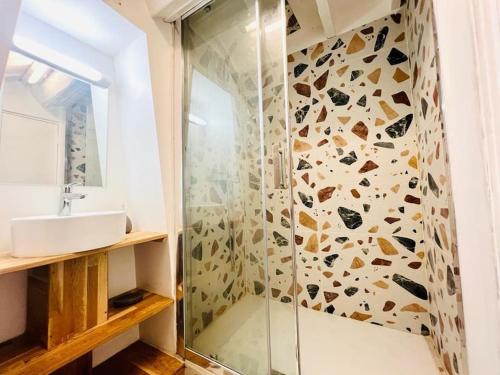 a bathroom with a shower and a sink at Lovely flat 20min from Champs Élysée, 10min from Stade de France in Saint-Denis