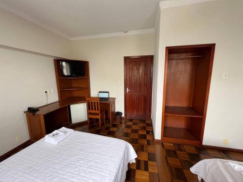 Cama ou camas em um quarto em Acomodare Hotel