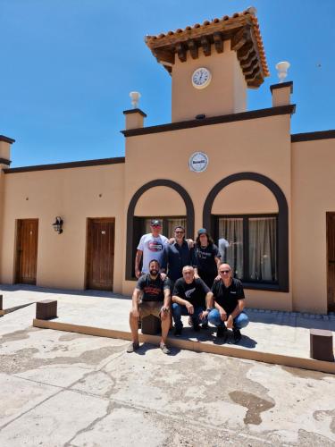 a group of people posing in front of a building at Museo Posada Benelli in San Rafael
