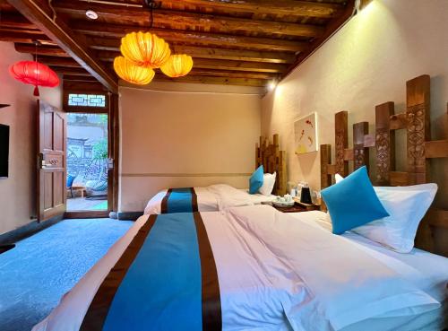 Ένα ή περισσότερα κρεβάτια σε δωμάτιο στο Juxian Boutique Homestay