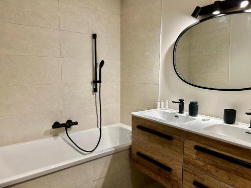 a bathroom with a shower and a sink and a mirror at Appartement Les Allues, 5 pièces, 9 personnes - FR-1-613-103 in Les Allues