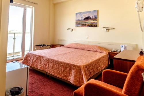 Postel nebo postele na pokoji v ubytování Hotel Pappas