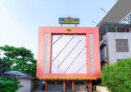 a building with a sign on top of it at Itsy By Treebo - Golden Birds in Mumbai