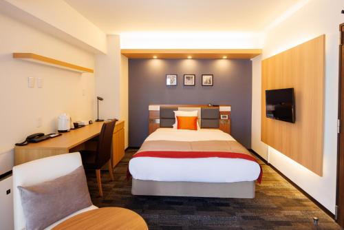 Postel nebo postele na pokoji v ubytování Floral Hotel East Shinsaibashi