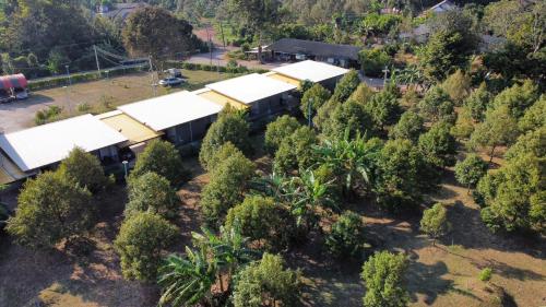 an aerial view of a building surrounded by trees at D-2 Home in Chanthaburi