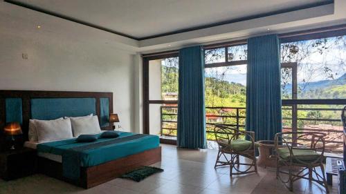 a bedroom with a bed and a large window at Ella Dream Mount in Ella