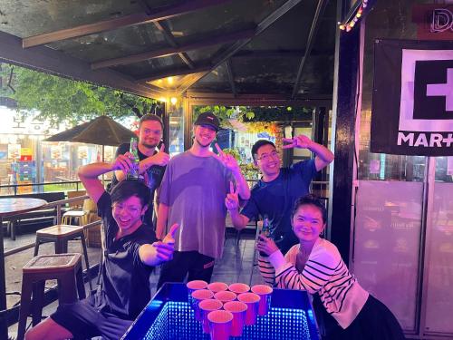 a group of people posing for a picture at Hithere City Myeongdong in Seoul