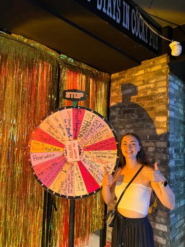 a woman standing next to a colorful umbrella at Hithere guesthouse in Seoul
