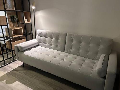 a white couch in a living room at • POWER STYLE • Apto con terraza in Bogotá