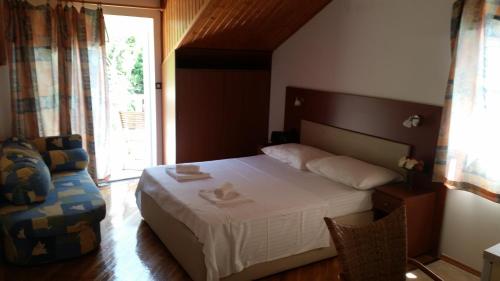 Postel nebo postele na pokoji v ubytování Apartments Vile Holiday