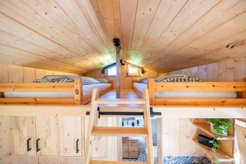 a tree house with two bunk beds in it at Gloans Glück Ferienhaus in Frasdorf