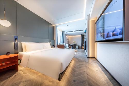 Postel nebo postele na pokoji v ubytování Atour S Hotel Jinan Shunhe