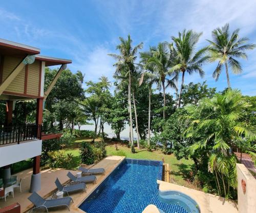 a view of the pool at the resort at Amatapura Beachfront Villa 15, SHA Certified in Ao Nam Mao
