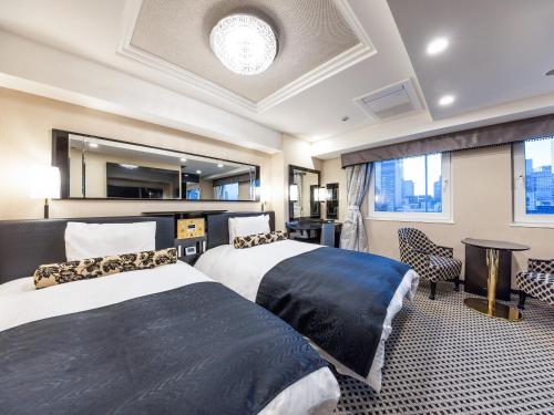 Postel nebo postele na pokoji v ubytování APA Hotel Kayabacho Hachobori Ekimae