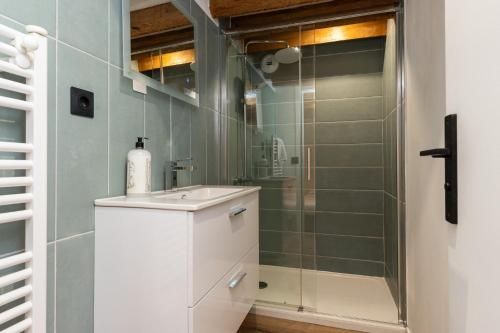 a bathroom with a sink and a shower at SmartStay Bird Family - Lyon in Lyon
