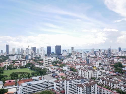 a cityscape of a city with tall buildings at Beacon Executive Suite by Uptrend Home Management in George Town