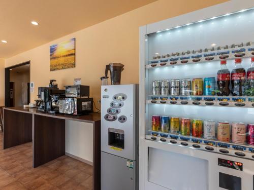 a drink vending machine in a coffee shop at Tabist OSAKA PORT HOTEL L'ESPOIR in Osaka