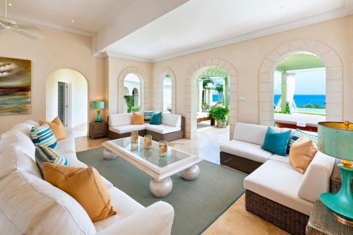 a living room with white couches and a table at Marsh Mellow by Blue Sky Luxury in Saint James